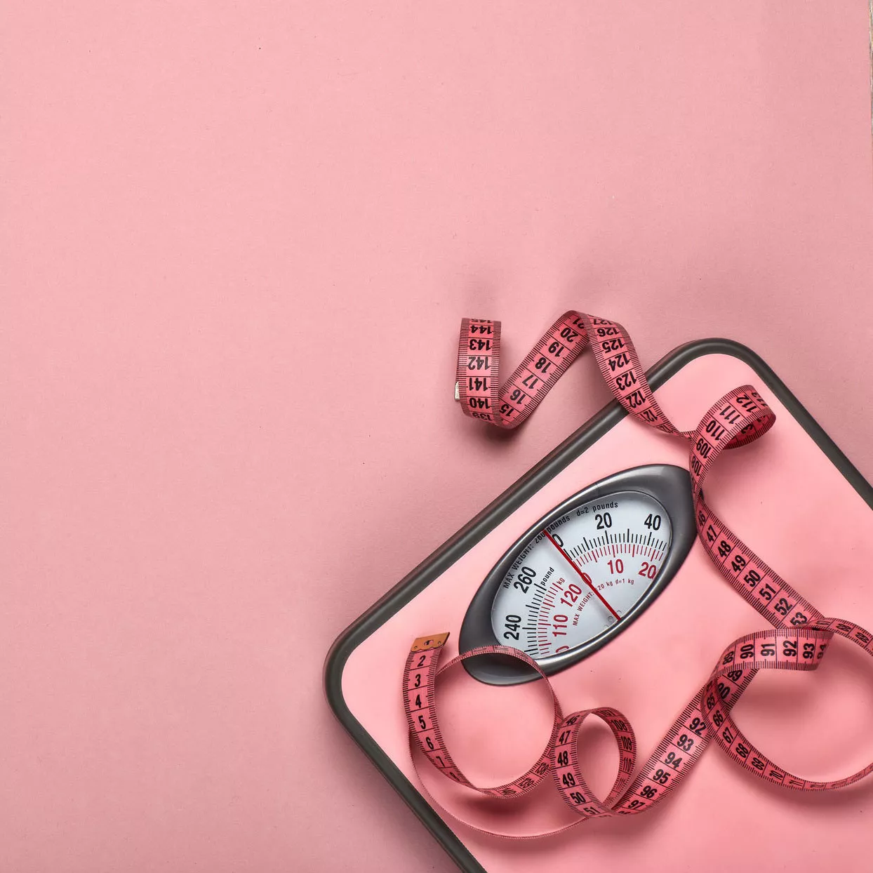 pink scale with pink measuring tape draped on top